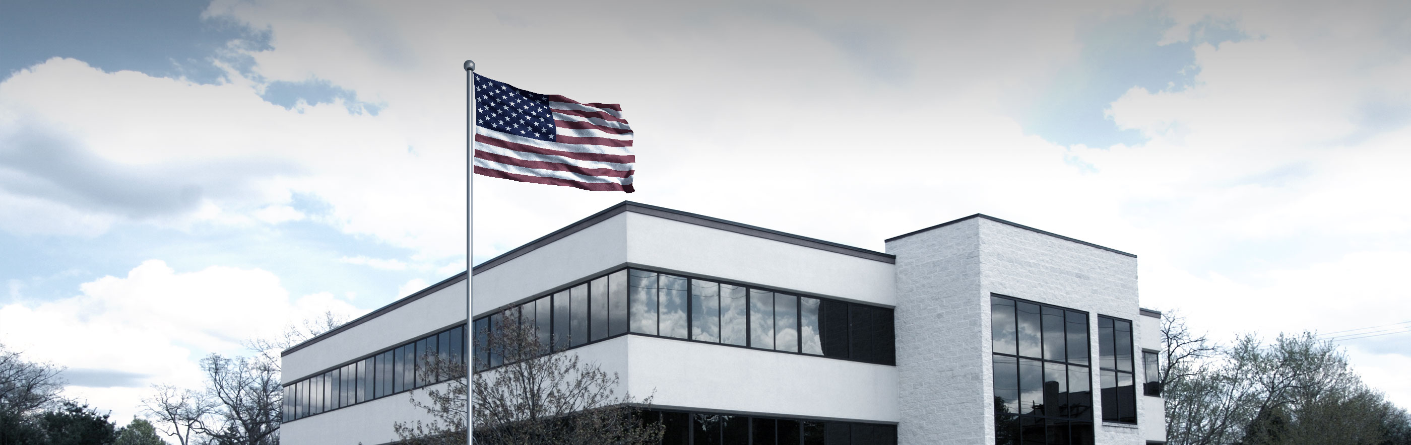 USA flagpole in front of ProCon Roofing building in USA